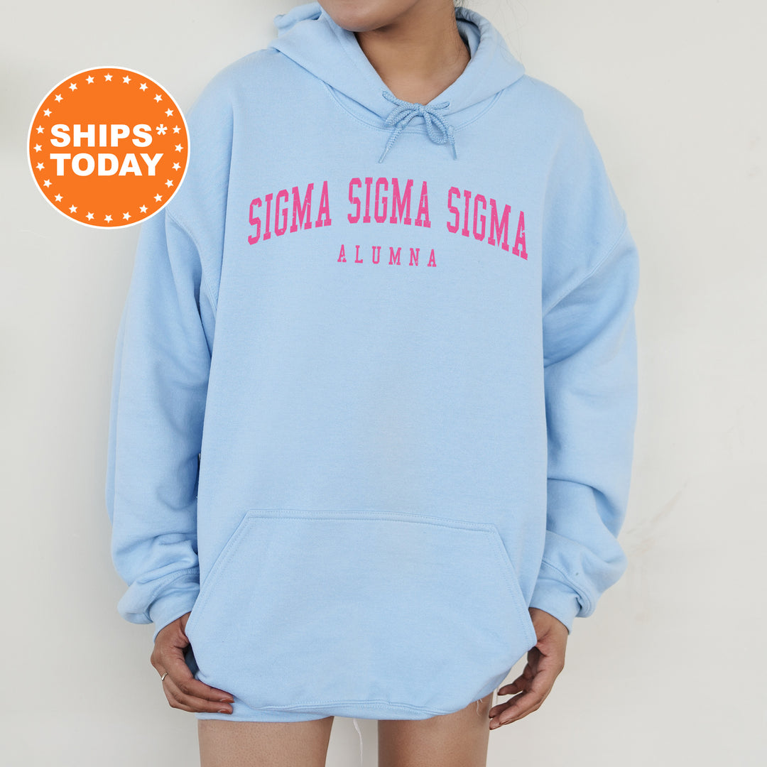 a woman wearing a light blue hoodie with the words stigmaa stigmaa on