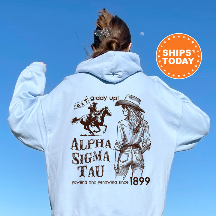 a woman wearing a white hoodie with an image of a woman riding a horse