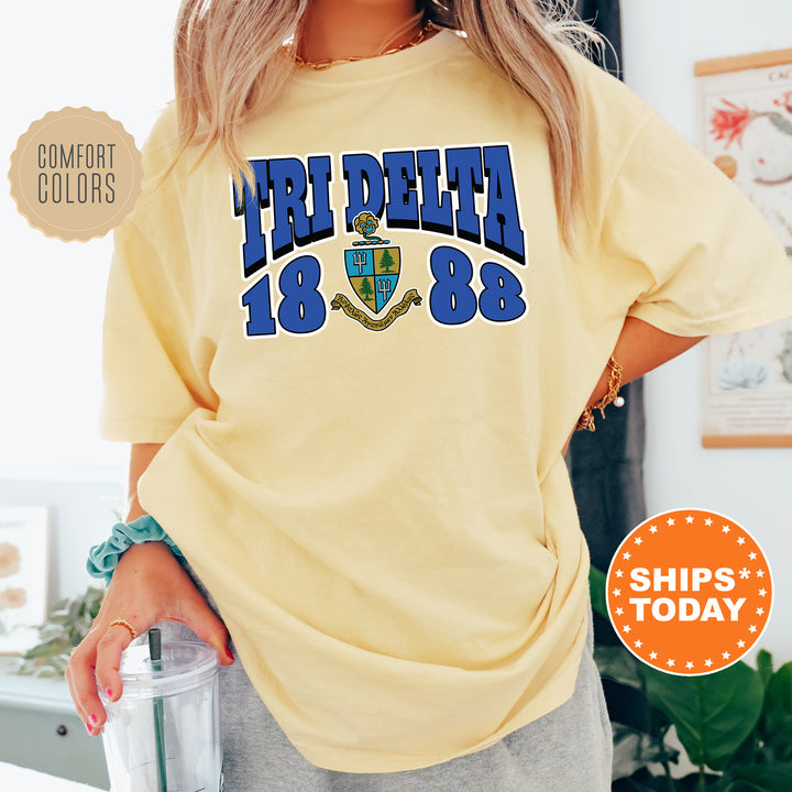 a woman wearing a yellow t - shirt with the words free delta on it