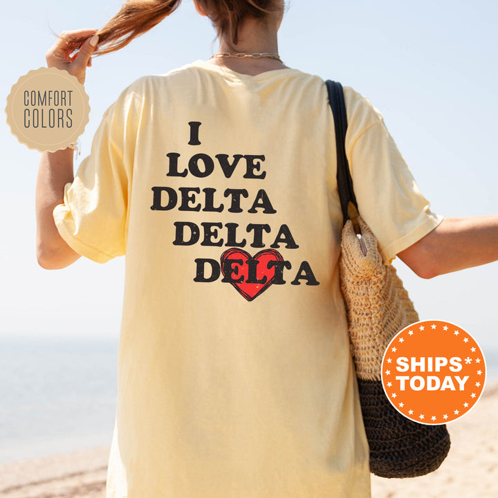 a woman with a yellow shirt that says i love delta delta