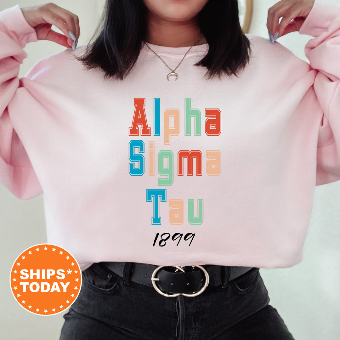 a woman wearing a pink shirt that says aloha stigma tau