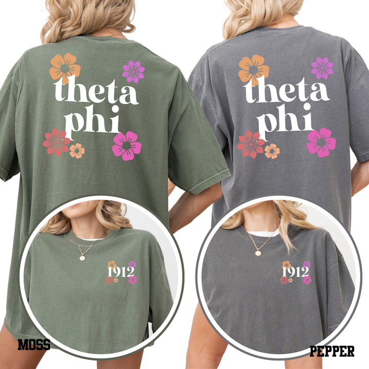 two back views of women wearing t-shirts with the text "theta phi" printed on them.