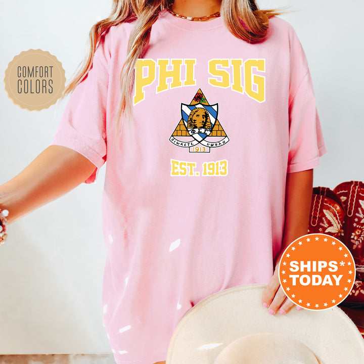 a woman wearing a pink phi sig shirt