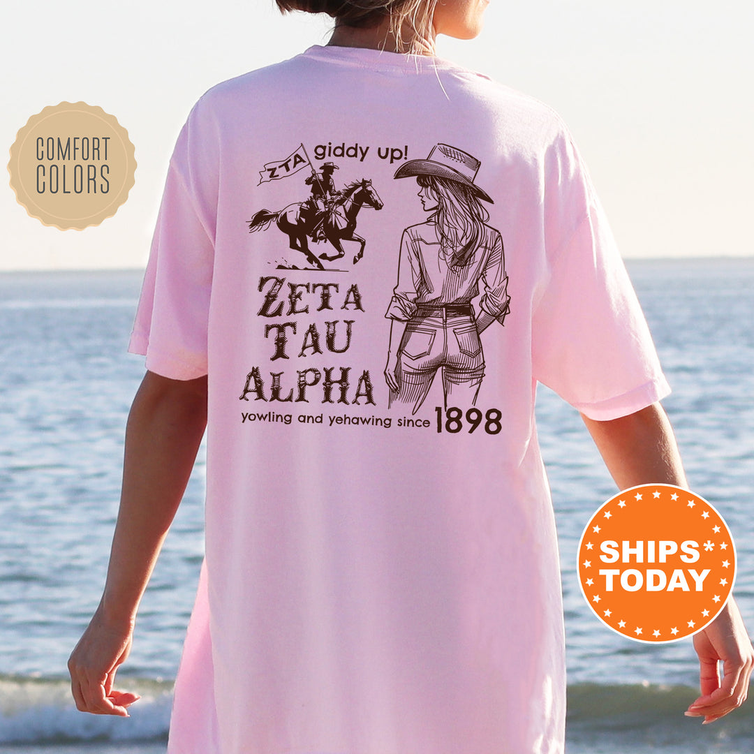 a woman wearing a pink t - shirt with a picture of a cowboy on it