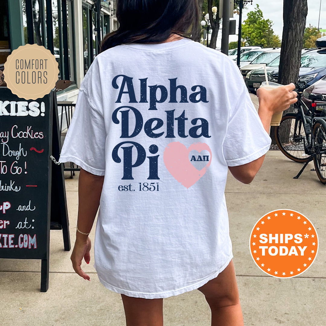 a woman walking down a sidewalk while wearing a white shirt