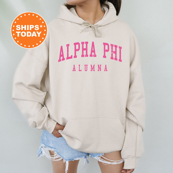 a woman wearing a sweatshirt with the word alpha phi on it