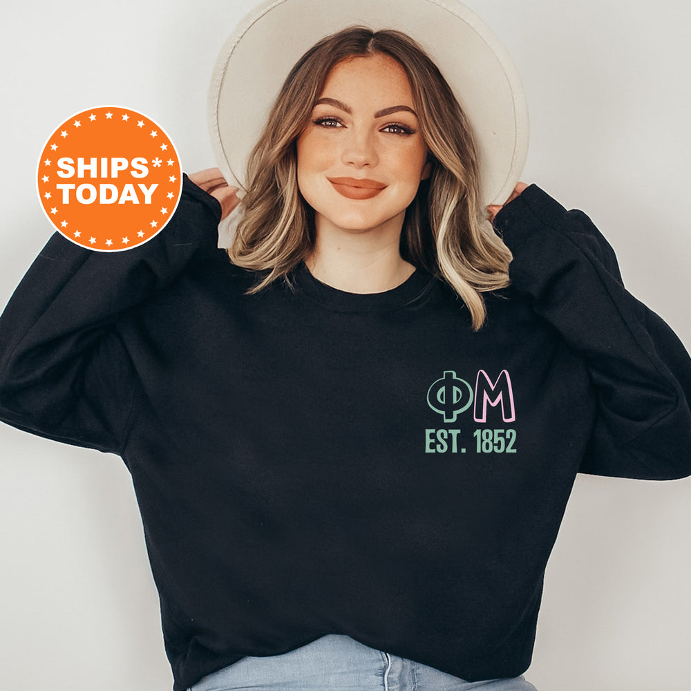 a woman wearing a black sweatshirt and a white hat
