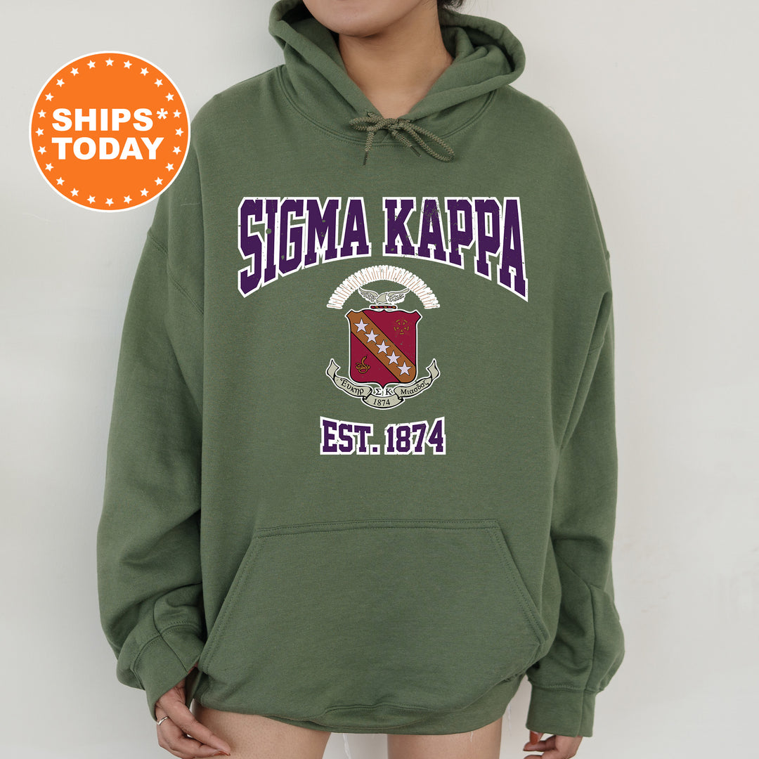 a woman wearing a green hoodie with the words sigma kappa