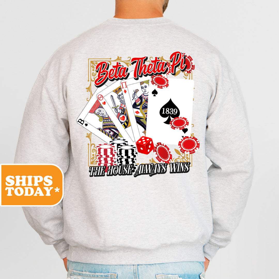 a man wearing a sweatshirt with a back print of playing cards
