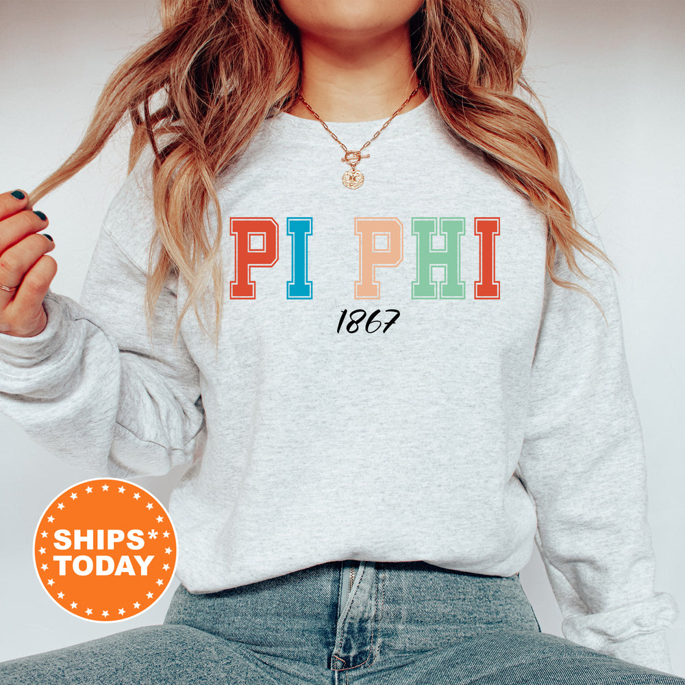 a woman wearing a sweatshirt with the word pi phi on it