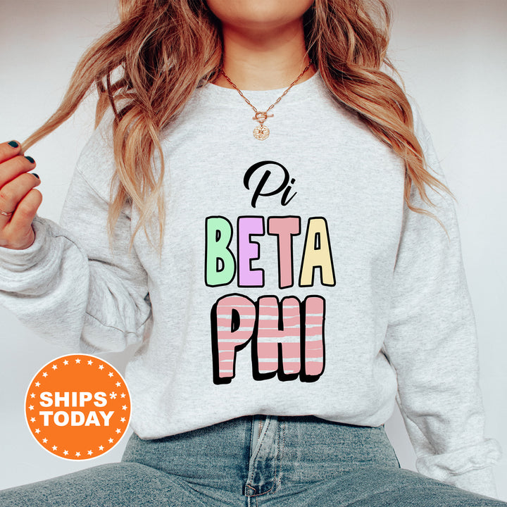 a woman wearing a sweatshirt with the words beta phi printed on it