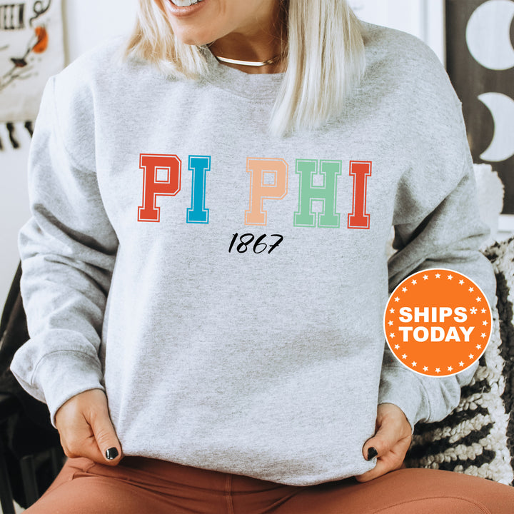 a woman wearing a sweatshirt that says pi phi