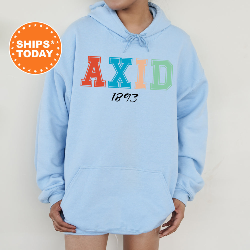 a woman wearing a blue hoodie with the word axid printed on it