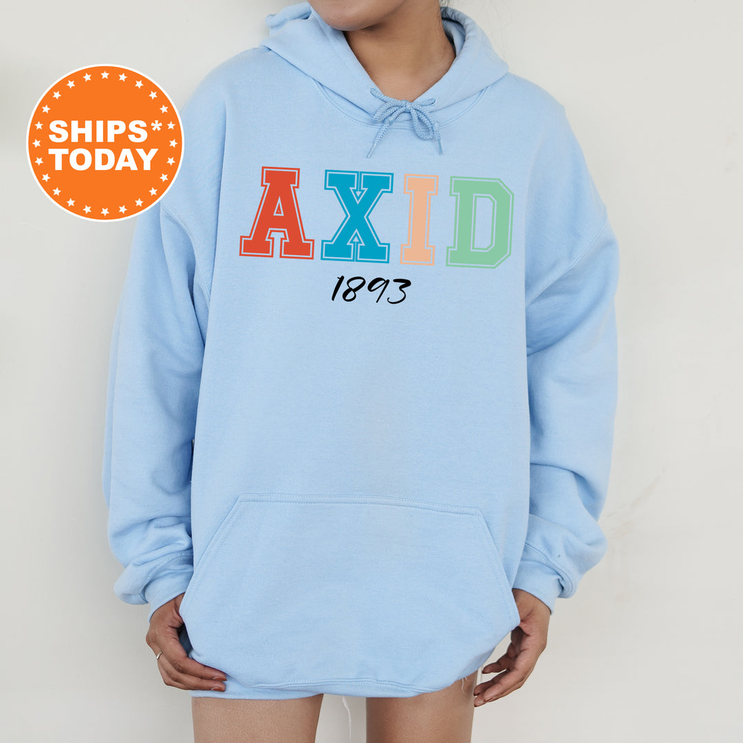 a woman wearing a blue hoodie with the word axid printed on it