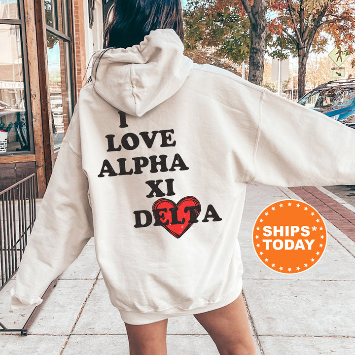 a woman walking down a sidewalk wearing a white hoodie
