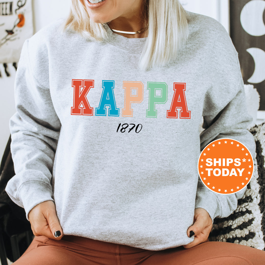 a woman wearing a sweatshirt that says kappa