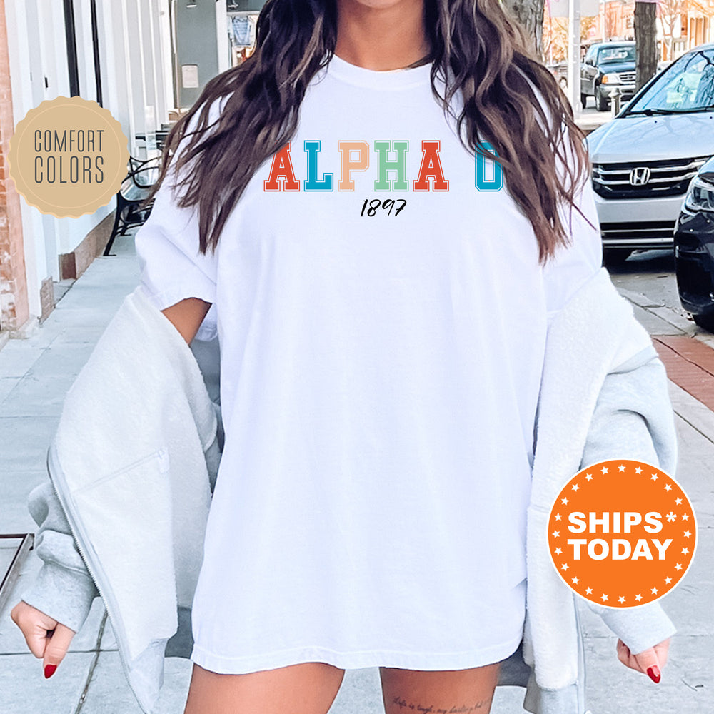 a woman wearing a white shirt with the word alpha printed on it