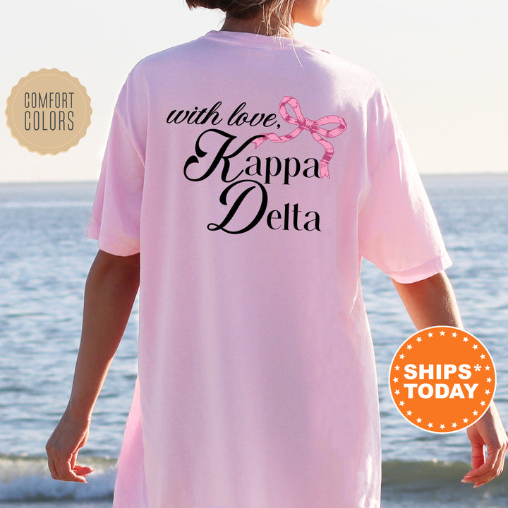 a woman wearing a pink shirt that says with love kapaa delta