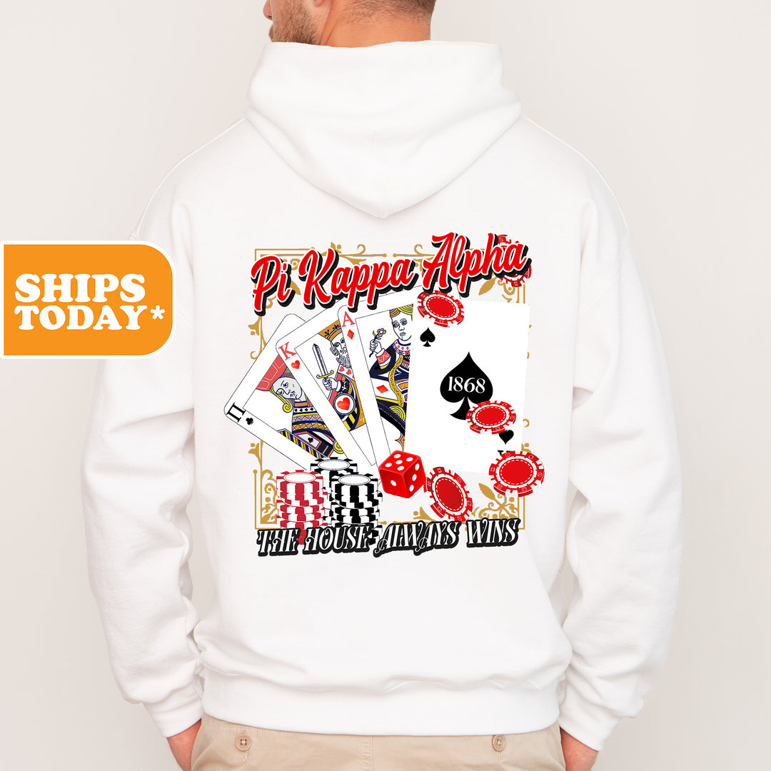 a man wearing a white hoodie with a picture of playing cards on it