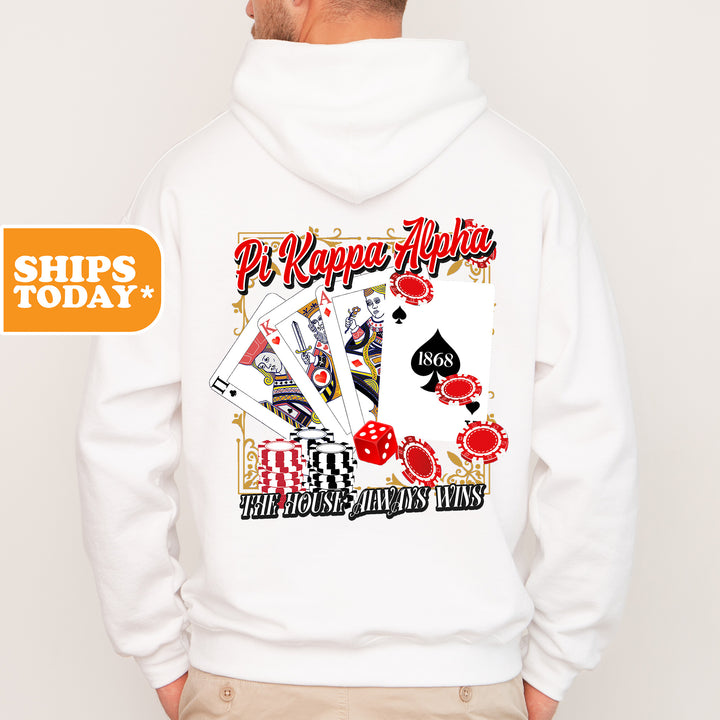 a man wearing a white hoodie with a picture of playing cards on it