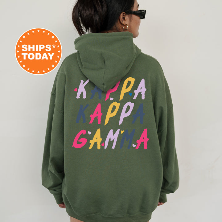 a woman wearing a green hoodie with the words happy game printed on it