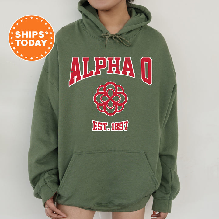 a person wearing a green hoodie with a flower on it