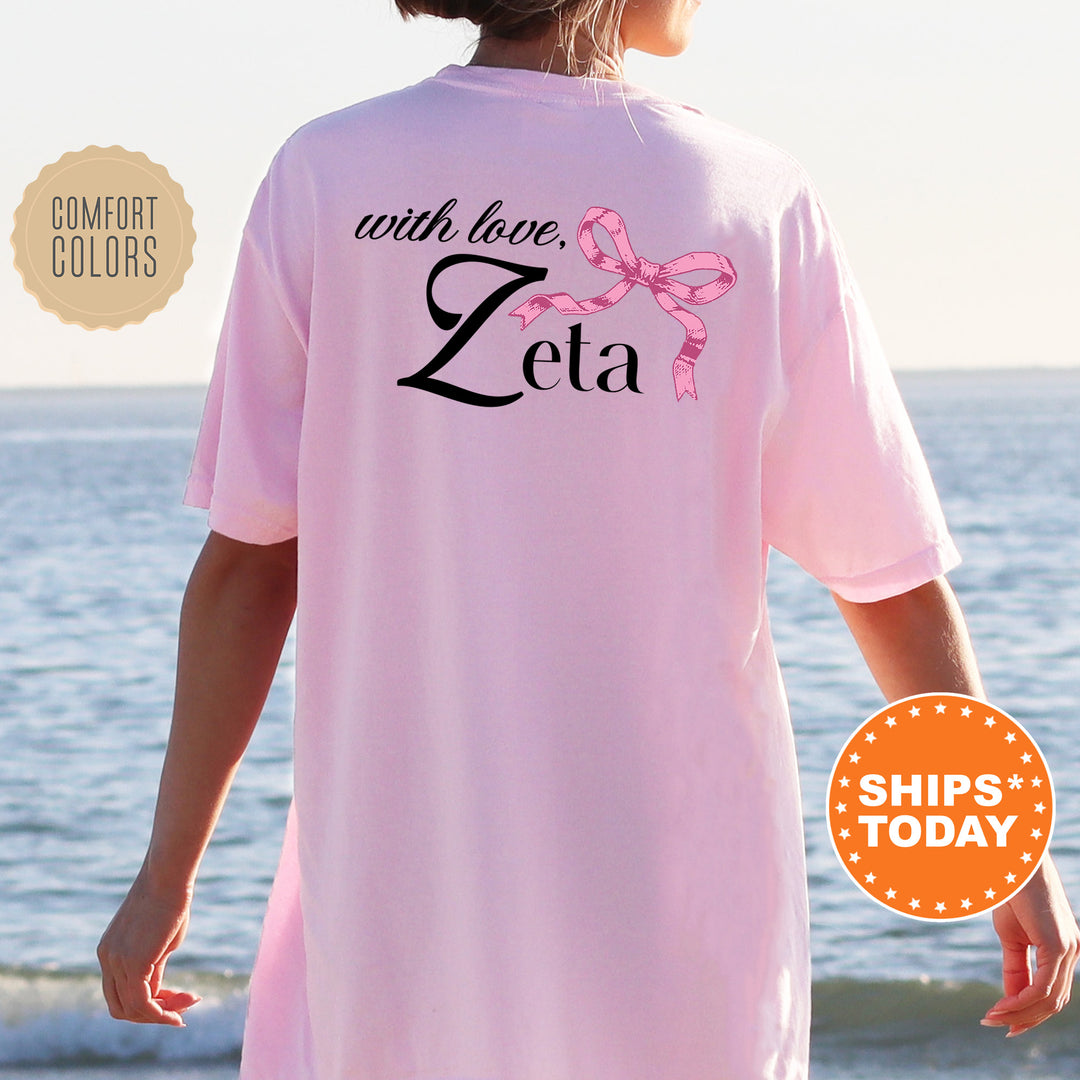 a woman wearing a pink shirt that says with love, zeia