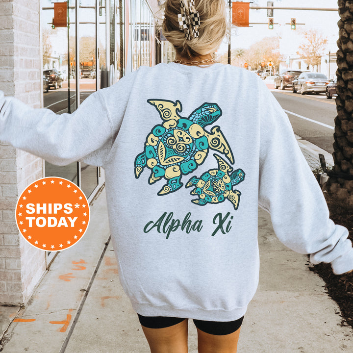 A person wearing a white sweatshirt with a graphic of two turtles printed on it, standing on a sidewalk.