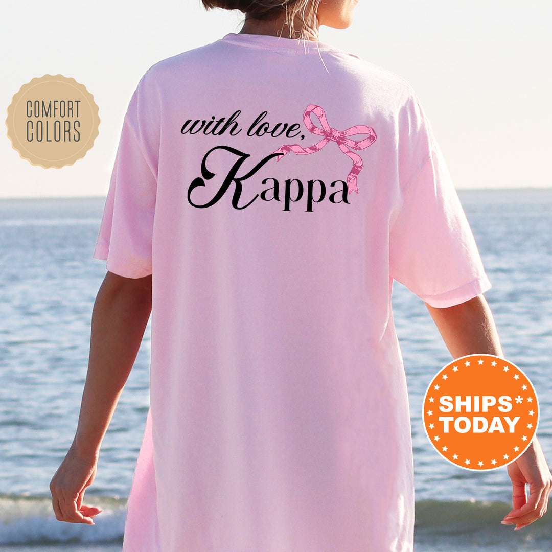 a woman wearing a pink shirt that says with love kappa