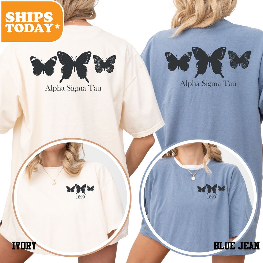 a woman wearing a blue and white shirt with black butterflies on it