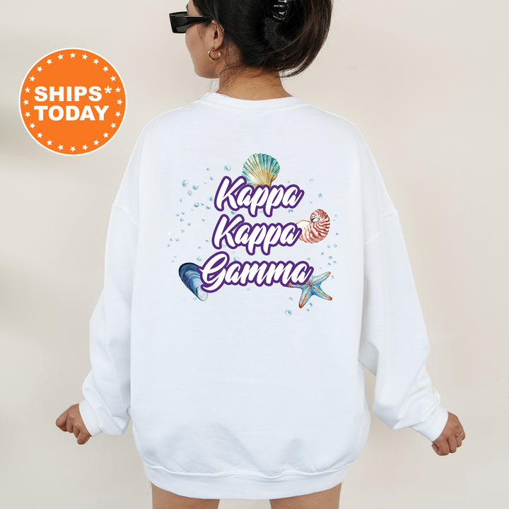 a woman wearing a white sweatshirt with the words kapa kapo kapo gen
