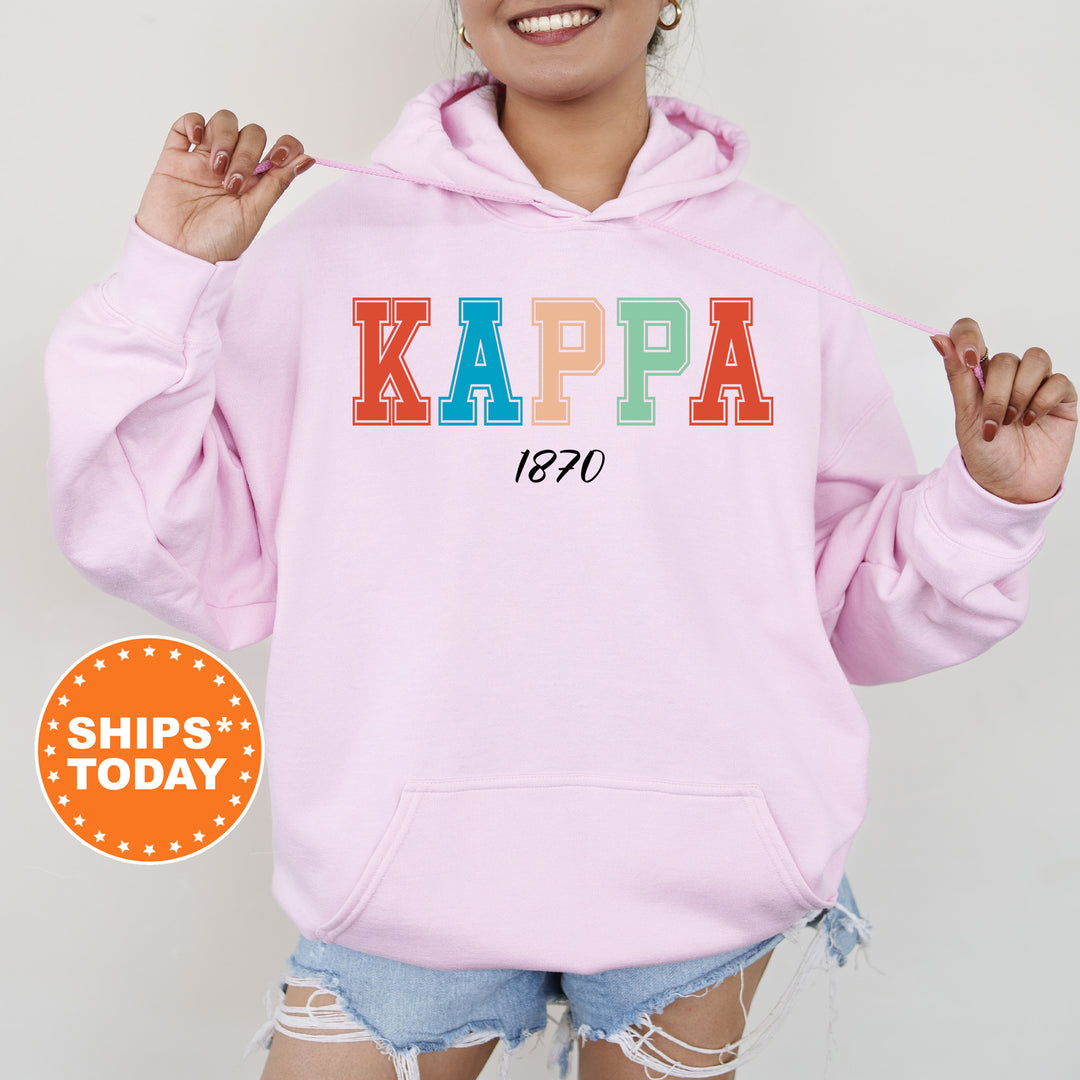 a woman wearing a pink kappa sweatshirt and ripped shorts