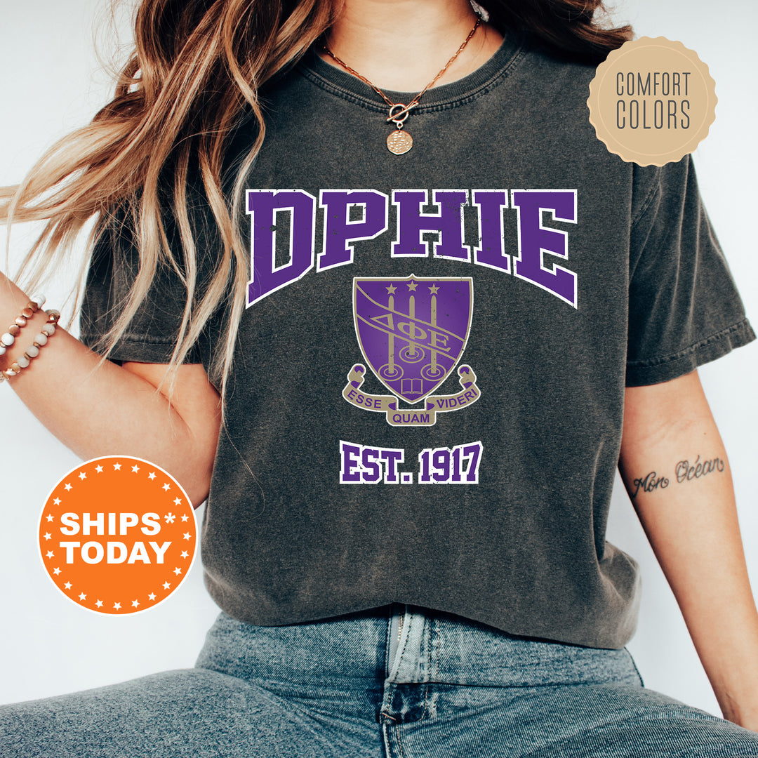 a woman wearing a black shirt with purple letters on it