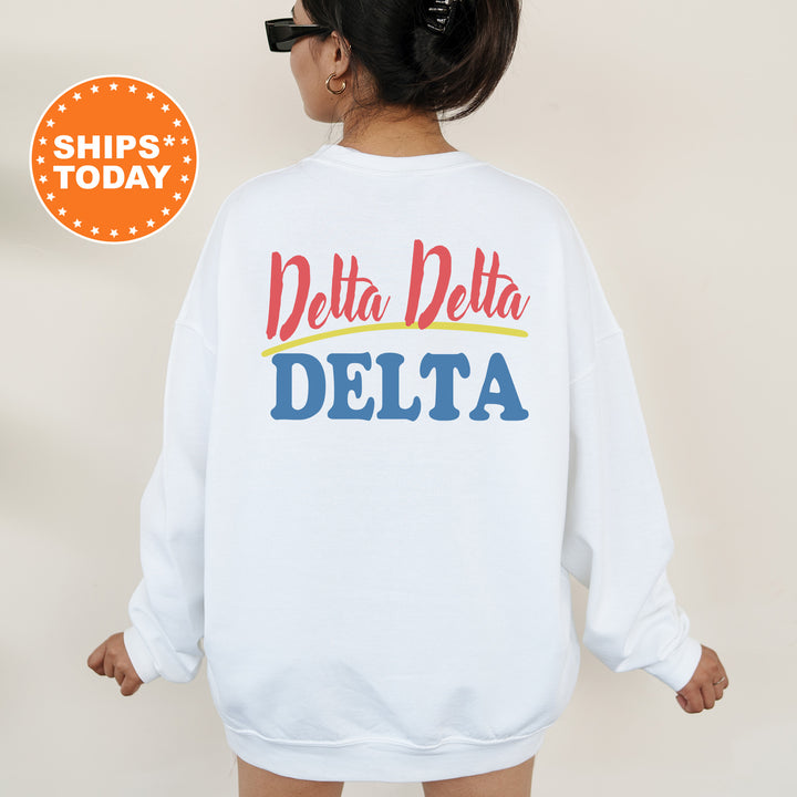 A person wearing a white sweatshirt with the text "Delta Delta" printed on the back.