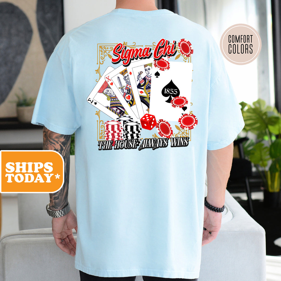 a man wearing a blue shirt with playing cards on it