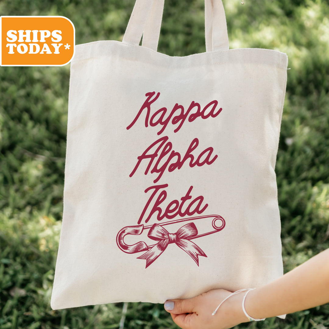 a person holding a tote bag with the words kappa ahha tea