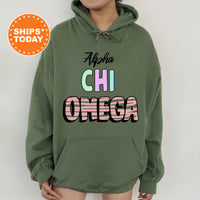 a woman wearing a green hoodie with the words africa on it