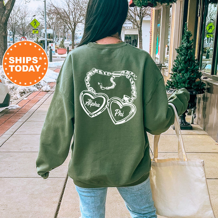 A person wearing a green sweatshirt with white text and symbols printed on it, walking on a sidewalk.