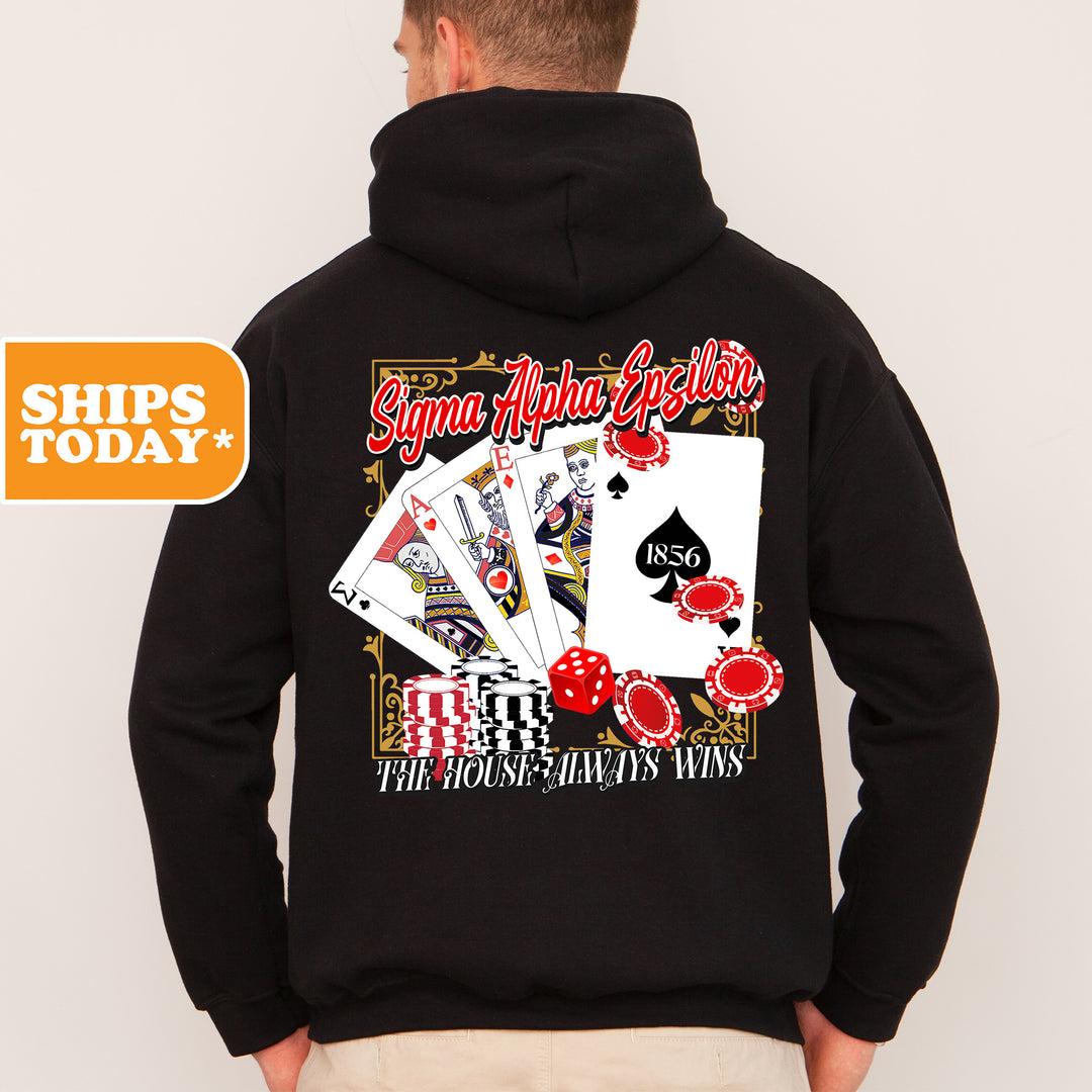a man wearing a black hoodie with a card game on it