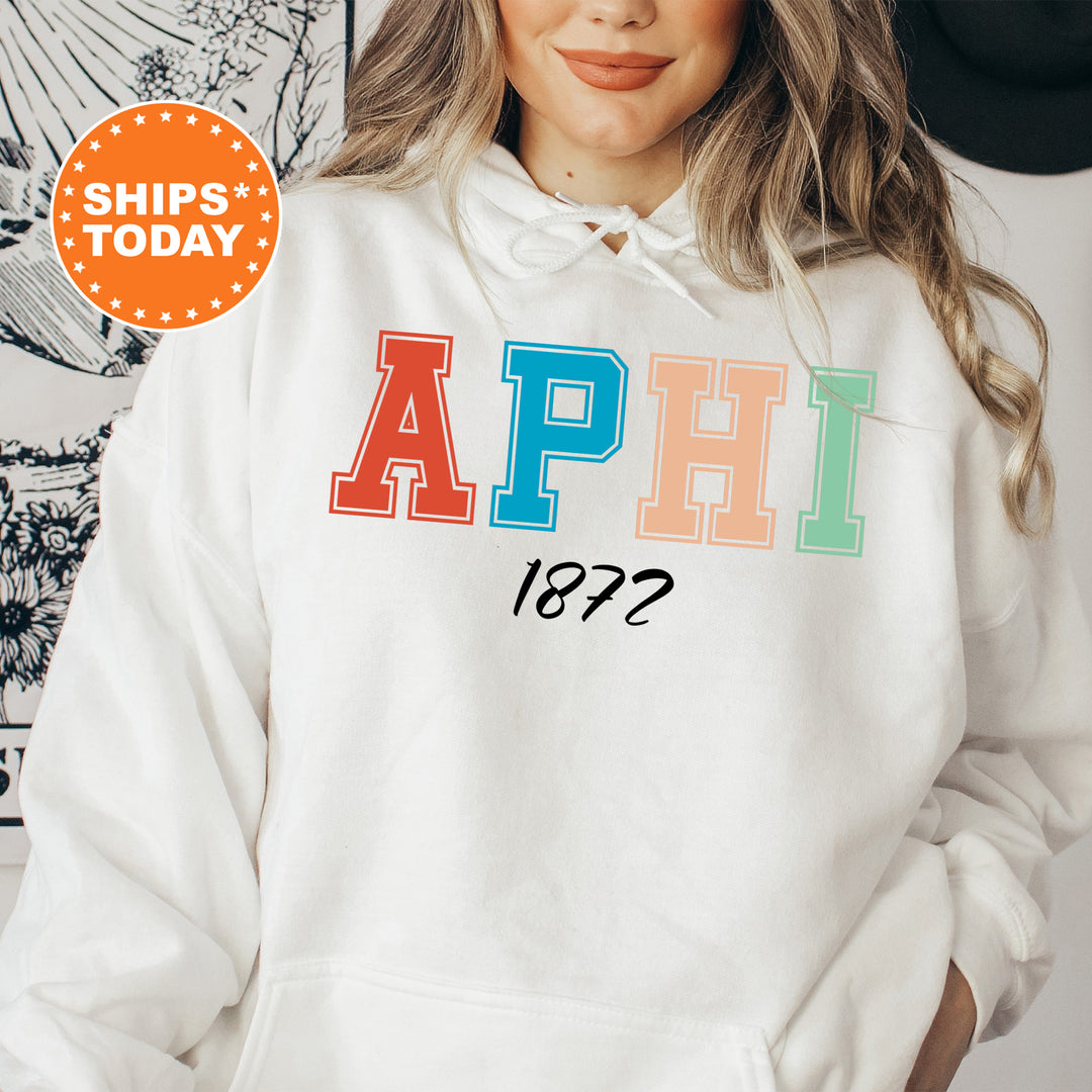a woman wearing a white hoodie with the words aphi on it