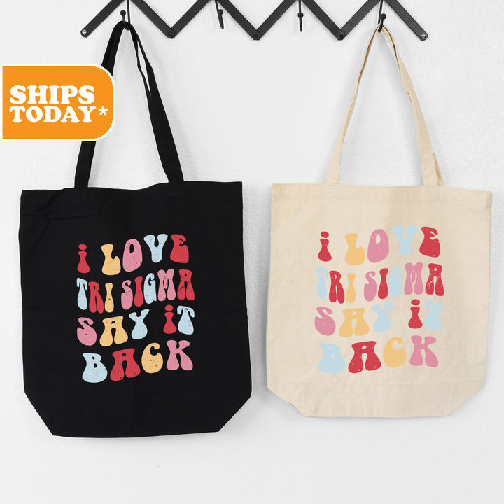 two totes hanging on a wall next to each other