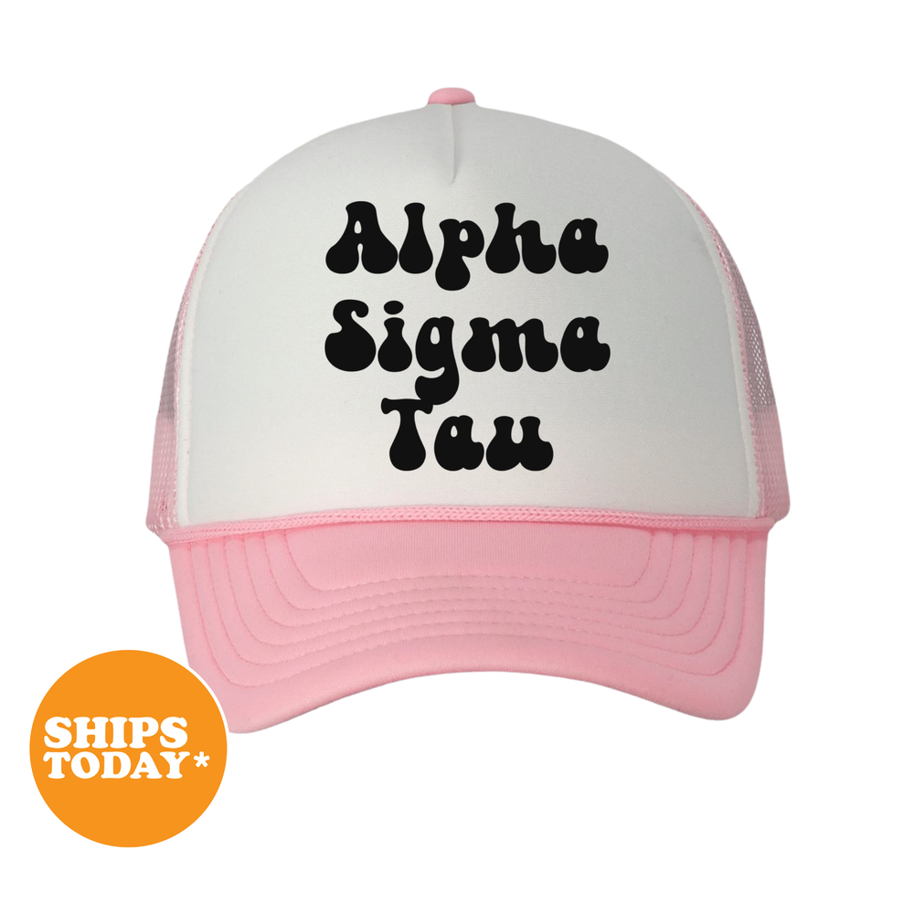 A pink and white baseball cap with the text "Alpha Sigma Tau" printed on it.