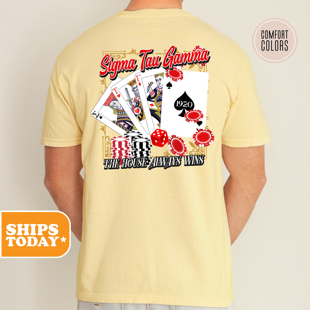 a man wearing a t - shirt with a picture of playing cards on it