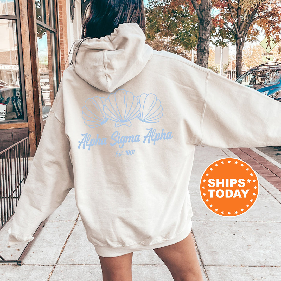 A person wearing a white hoodie with the logo of Alpha Sigma Alpha, a sorority, printed on the back.