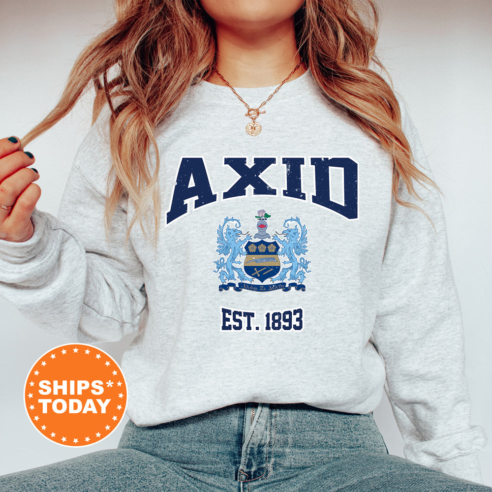 a woman wearing a sweatshirt with a crest on it