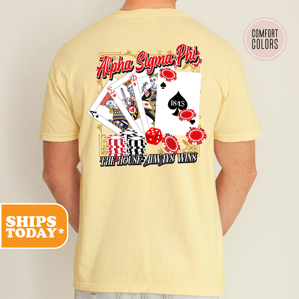 a man wearing a t - shirt with a picture of playing cards on it