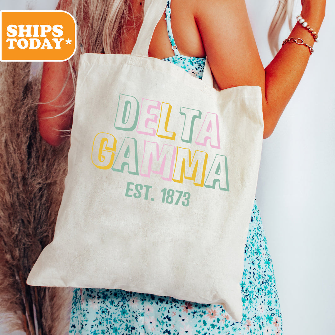 a woman holding a white bag with the words delta gama printed on it