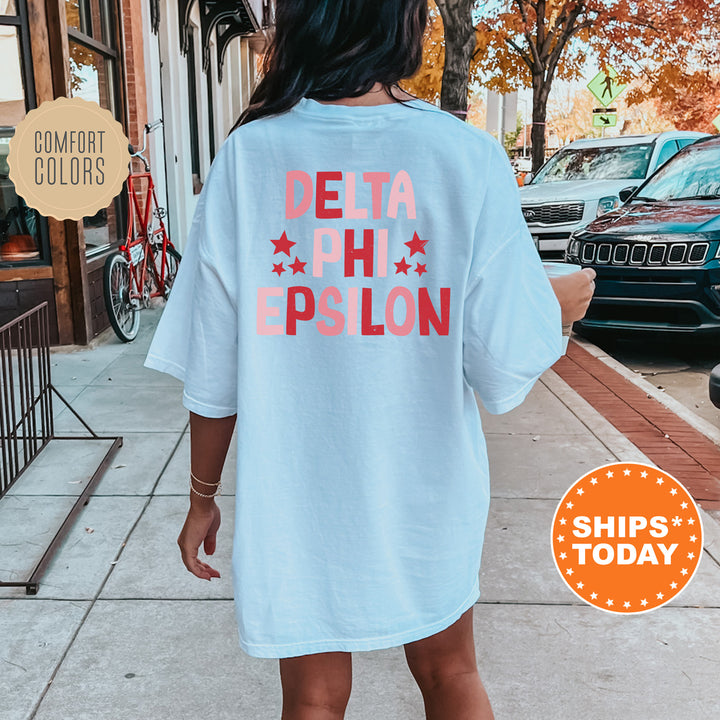 a woman is walking down the sidewalk wearing a t - shirt