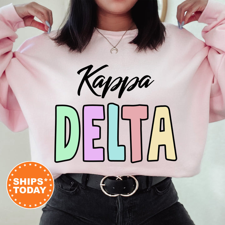 a woman wearing a pink sweatshirt that says kapaa delta