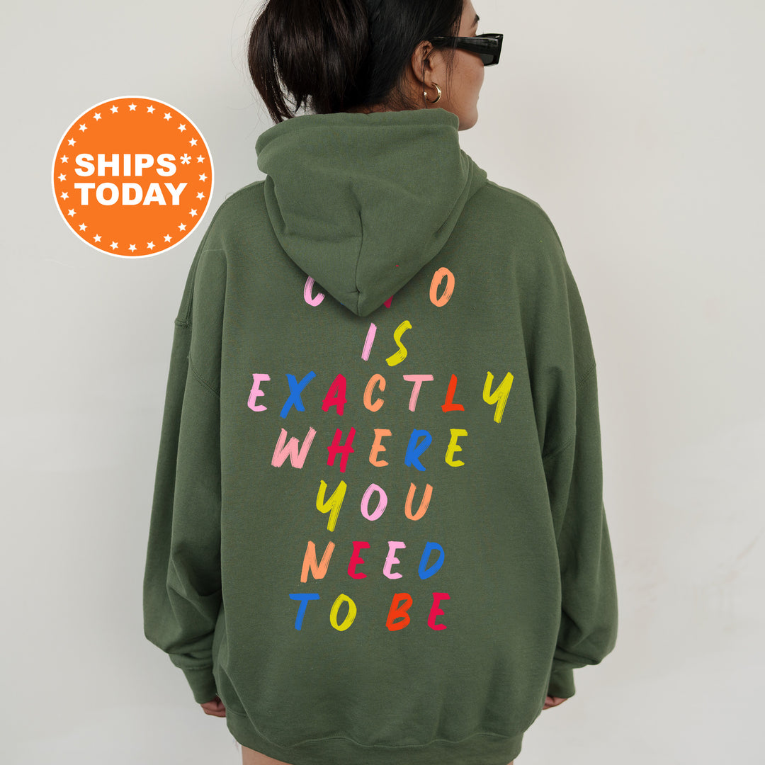 a woman wearing a green hoodie that says us is exactly where you need to
